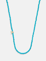 BaubleBar A - 
    Asymmetrical beaded initial necklace
  
