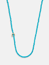 BaubleBar C - 
    Asymmetrical beaded initial necklace
  
