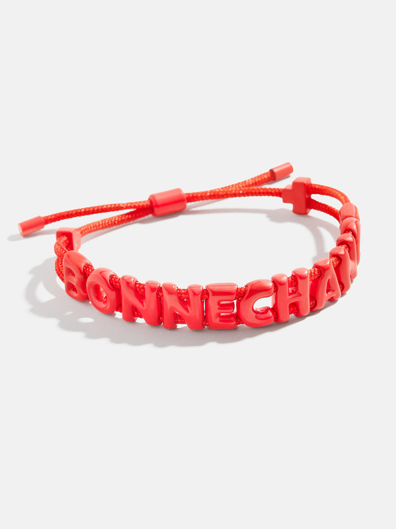 BaubleBar Bonne Chance - 
    Adjustable pull-tie bracelet - 10 different phrases available
  
