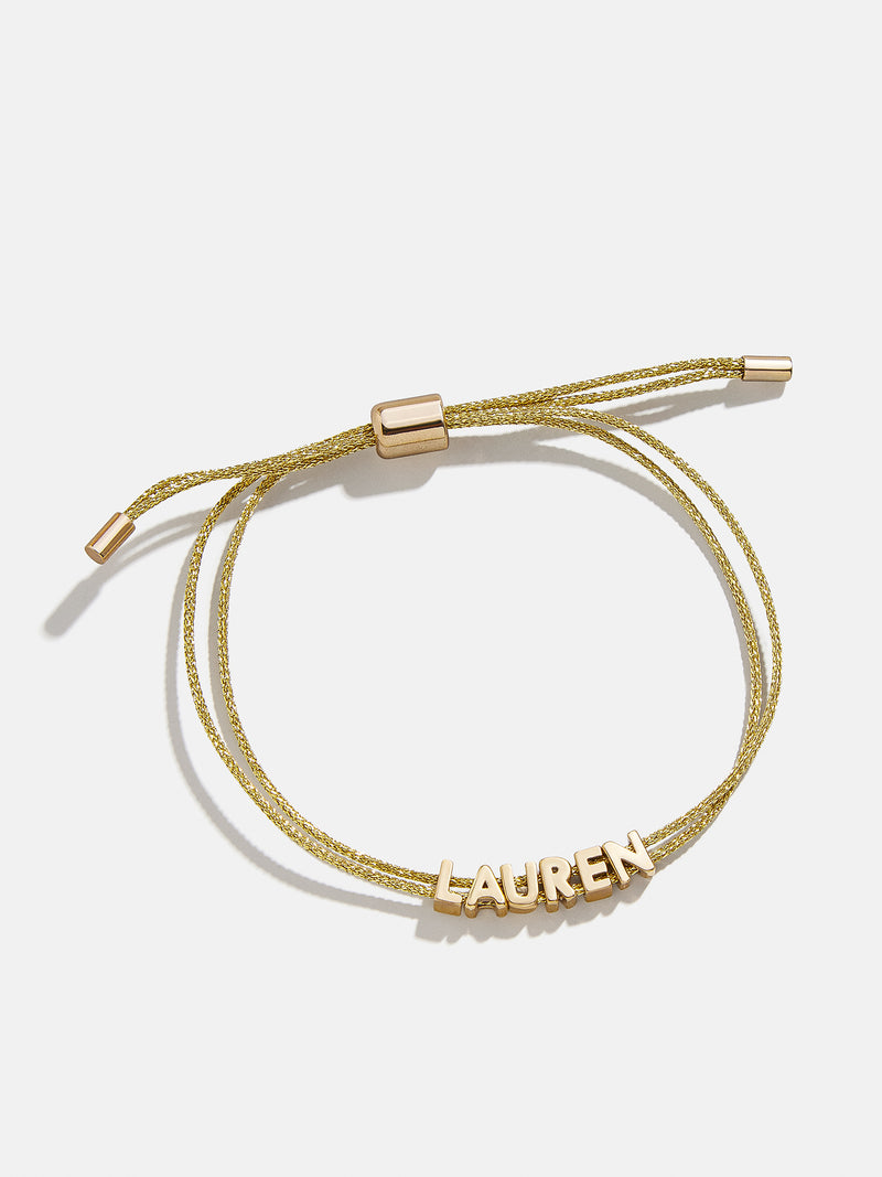 BaubleBar Custom Cord Bracelet - Gold -
Custom nameplate bracelet
