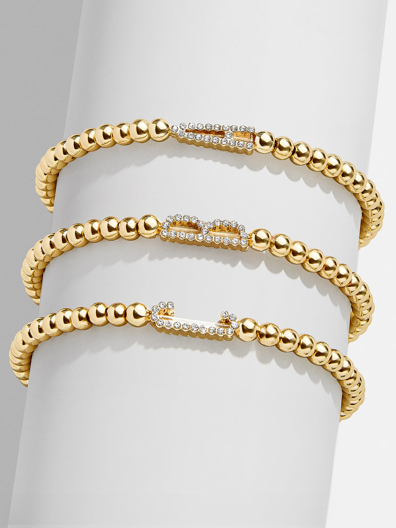 BaubleBar East West Initial Pisa Bracelet - Clear/Gold - 
    Initial beaded bracelet
  
