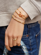 BaubleBar Disney Character Bite Pisa Bracelet - Mickey Mouse Pizza Pisa - 
    Disney gold beaded stretch bracelet