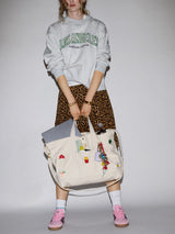 BaubleBar -
Hand select 6 icons to personalize your tote