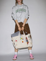 BaubleBar -
Hand select 6 icons to personalize your tote