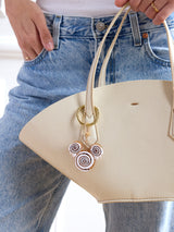 BaubleBar Disney Mickey Mouse Cinnamon Roll Bag Charm - Disney Cinnamon Roll Bag Charm -
Oversized Disney keychain