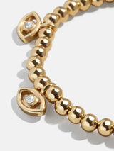 BaubleBar Good Days Pisa Bracelet - Evil Eye -
Gold beaded stretch bracelet