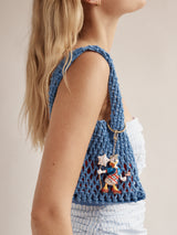 BaubleBar Disney Daisy Duck Americana Bag Charm - Daisy Duck - 
    Daisy Duck charm for bag