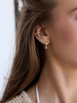 BaubleBar Kourtney Huggie Earrings - Kourtney Gold Plated Brass Earrings -
Gold earrings with crystals