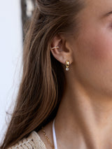 BaubleBar Kourtney Huggie Earrings - Gold/Pavé - 
    Gold earrings with crystals