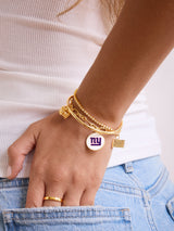 BaubleBar NFL Charm Bracelet - New York Giants - 
    Gold bracelet with charms