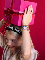 BaubleBar Bow & Behold Kids Headband - Black - 
    Black headband with bows