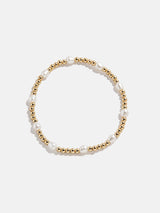 BaubleBar Pearl Stretch Bracelet - Spaced Pearls -
Gold bracelet for stacking