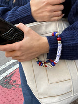 BaubleBar NFL Beaded Phone Charm - New York Giants - 
    Hands-free wristlet phone strap