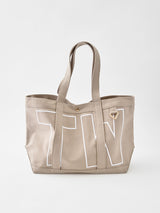 BaubleBar -
Personalized canvas tote bag with custom embroidered initials
