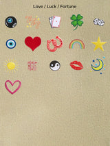 BaubleBar Beige -
Hand select 6 icons to personalize your tote