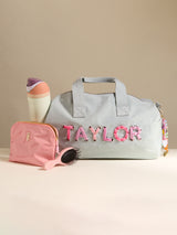 BaubleBar Thready to Go Kids’ Custom Duffle - Light Denim/Pink Multi -
Personalized travel bag