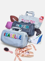 BaubleBar Thready to Go Kids’ Custom Duffle - Light Denim/Pink Multi -
Personalized travel bag