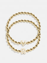 BaubleBar R - 
    Two kids' gold beaded stretch bracelets
  
