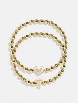 BaubleBar T - 
    Two kids' gold beaded stretch bracelets
  
