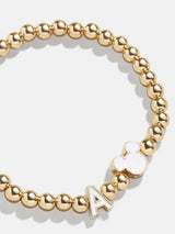 BaubleBar Mickey Mouse disney Initial Pisa Bracelet - White - 
    Disney gold beaded stretch bracelet
  
