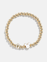 BaubleBar Q - 
    Disney gold beaded stretch bracelet
  
