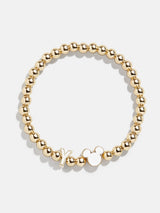 BaubleBar Y - 
    Disney gold beaded stretch bracelet
  
