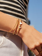 BaubleBar Mickey Mouse disney Initial Pisa Bracelet - White - 
    Disney gold beaded stretch bracelet
  
