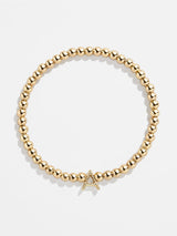 BaubleBar Gold / A - 
    Gold beaded stretch bracelet
  
