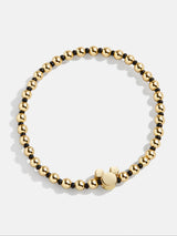 BaubleBar Black - Disney gold beaded stretch bracelet