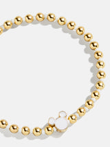 BaubleBar White - Disney gold beaded stretch bracelet