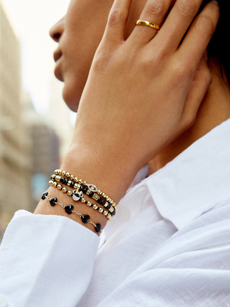 BaubleBar Black - Disney gold beaded stretch bracelet