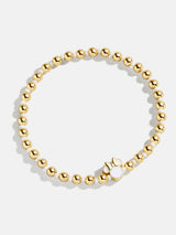 BaubleBar White - Disney gold beaded stretch bracelet