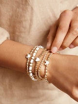 BaubleBar White - Disney gold beaded stretch bracelet