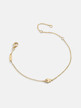 BaubleBar 18K Gold Hamsa Bracelet - Gold Hamsa - 
    18K Gold Plated Sterling Silver, Cubic Zirconia stones
  
