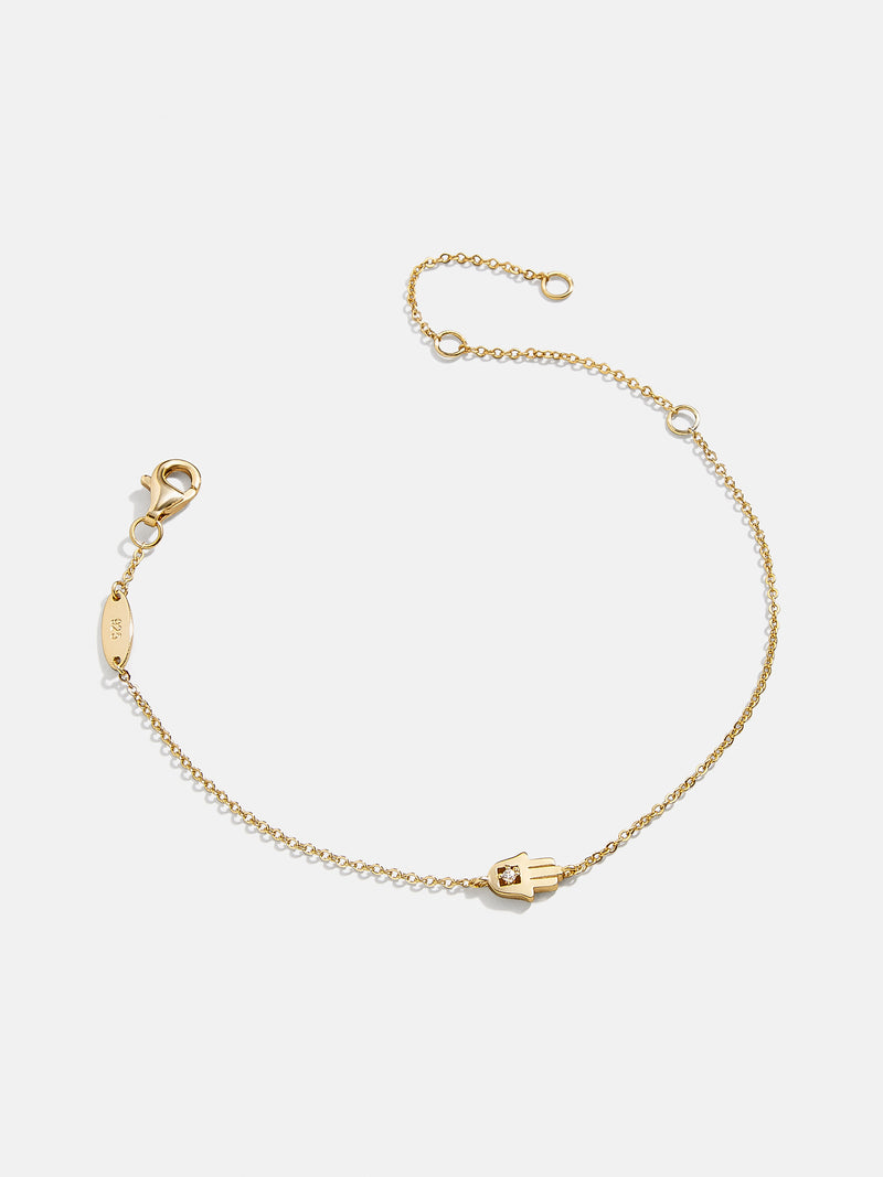 BaubleBar 18K Gold Hamsa Bracelet - Gold Hamsa - 
    18K Gold Plated Sterling Silver, Cubic Zirconia stones
  
