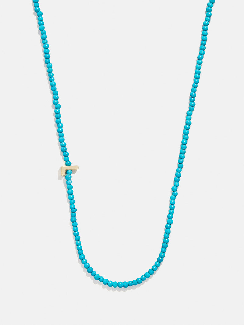 BaubleBar L - Asymmetrical beaded initial necklace