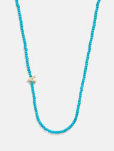 BaubleBar V - 
    Asymmetrical beaded initial necklace
  

