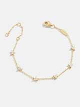 BaubleBar Sadira 18K Gold Bracelet - Flower Trio - 
    18K Gold Plated Sterling Silver, Cubic Zirconia stones
  
