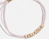 BaubleBar Custom Cord Bracelet - Soft Pink - 
    Custom nameplate bracelet
  
