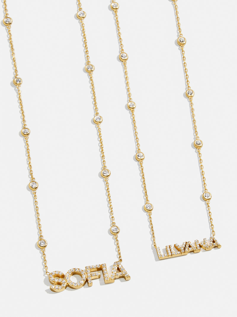 BaubleBar 18K Gold Custom Yasmine Nameplate Necklace - Clear/Gold - 
    18K Gold Plated Sterling Silver, Cubic Zirconia stones
  
