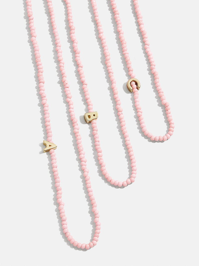 BaubleBar Rose Quartz Initial Necklace - Blush - Asymmetrical beaded initial necklace