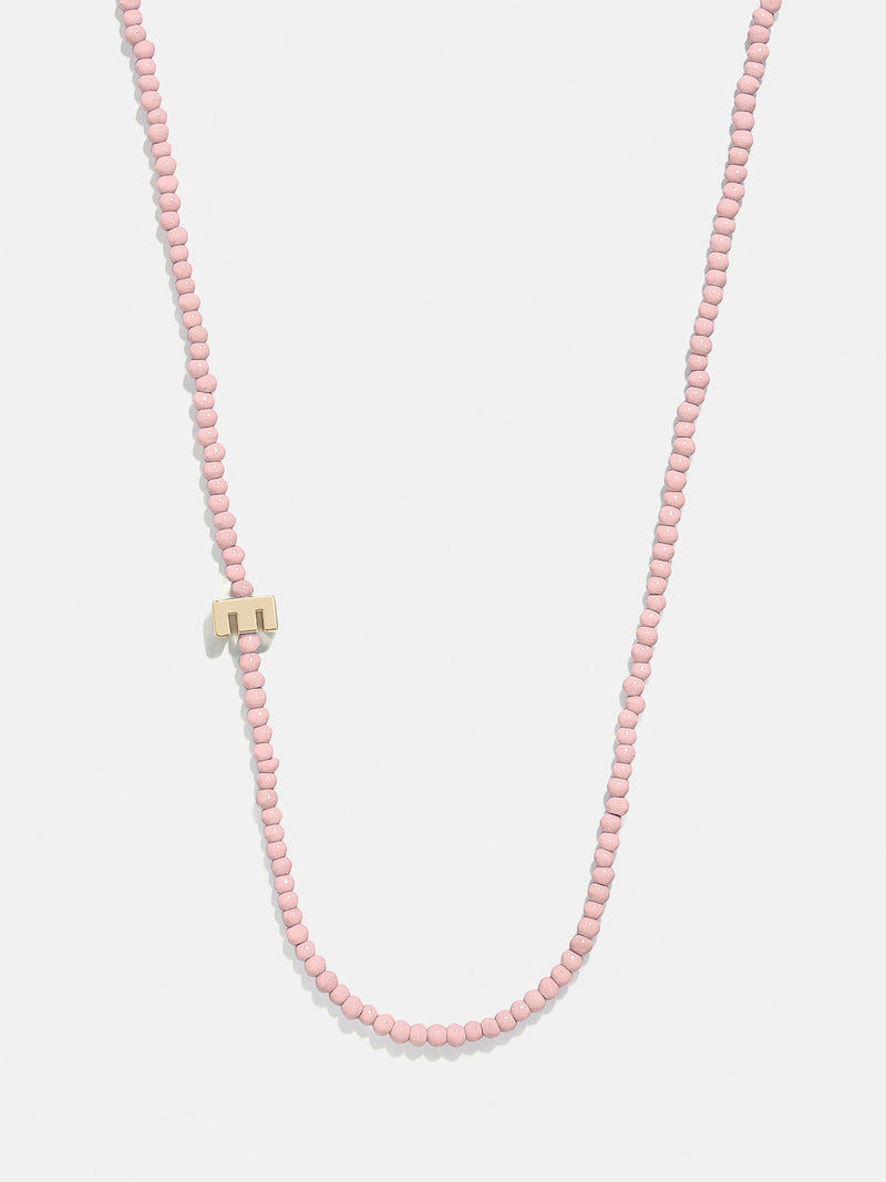 BaubleBar E - 
    Asymmetrical beaded initial necklace
  
