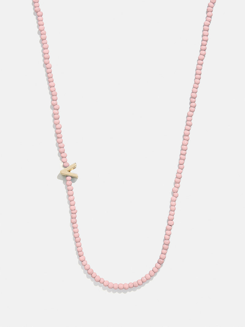 BaubleBar V - 
    Asymmetrical beaded initial necklace
  
