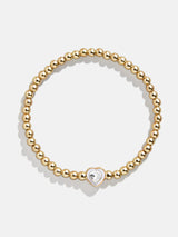 BaubleBar White - 
    Gold beaded stretch bracelet
  
