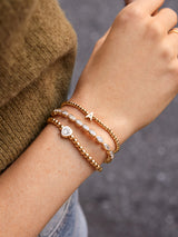 BaubleBar White - 
    Gold beaded stretch bracelet
  
