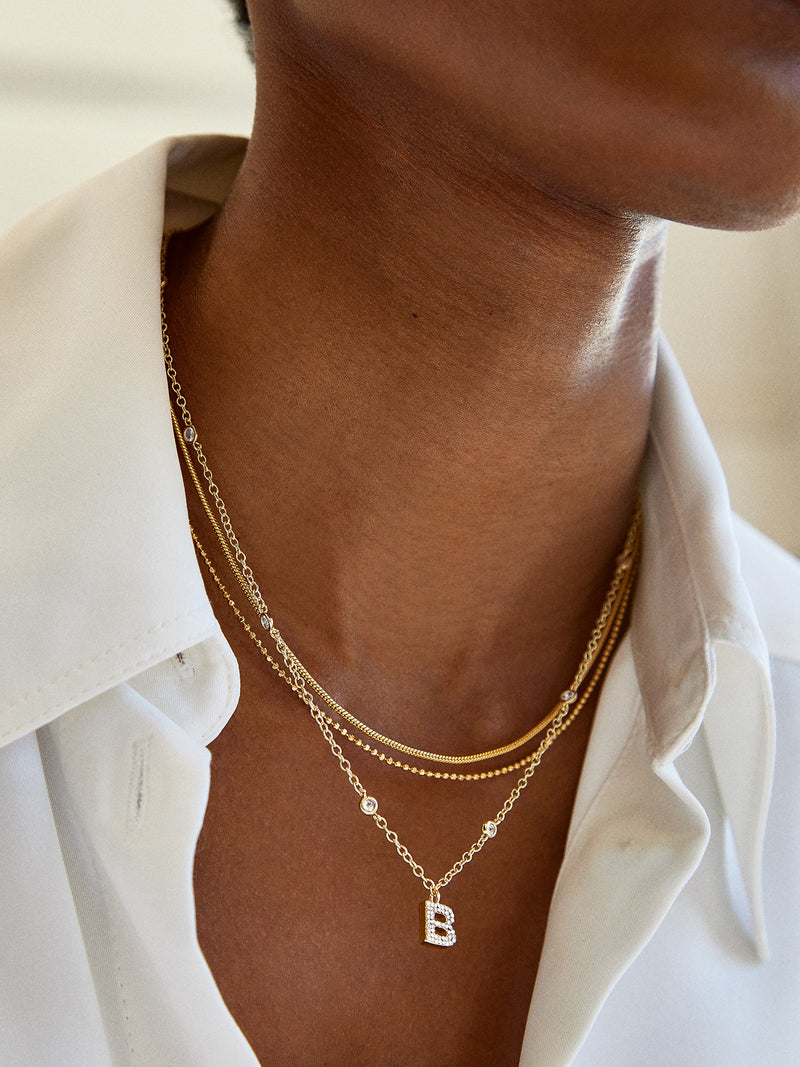 BaubleBar Pavé Initial Yasmine Necklace - Clear/Gold - 
    Initial necklace
  
