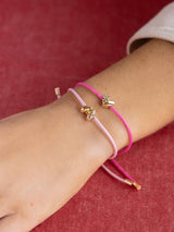 BaubleBar Kids' Cord Initial Bracelet Set - Pink - 
    Two cord pull-tie bracelets
  
