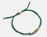 BaubleBar Custom Cord Bracelet - Dark Green - 
    Custom nameplate bracelet
  
