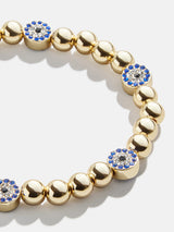 BaubleBar Isabella Bracelet - Blue/Gold - 
    Gold evil eye stretch bracelet
  
