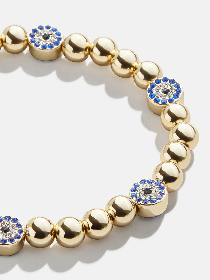 BaubleBar Isabella Bracelet - Blue/Gold - 
    Gold evil eye stretch bracelet
  
